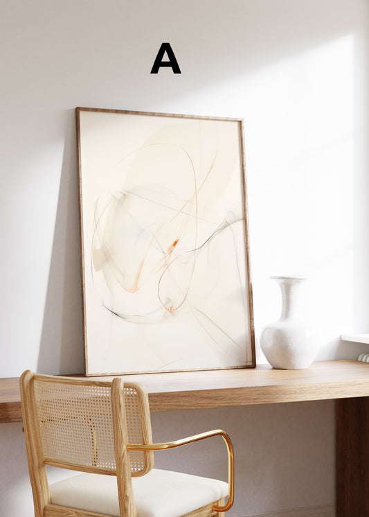 Postermotiv A: Feine abstrakte Linien in Grau und Orange auf cremefarbenem Grund. Im Holzrahmen auf einem Schreibtisch.