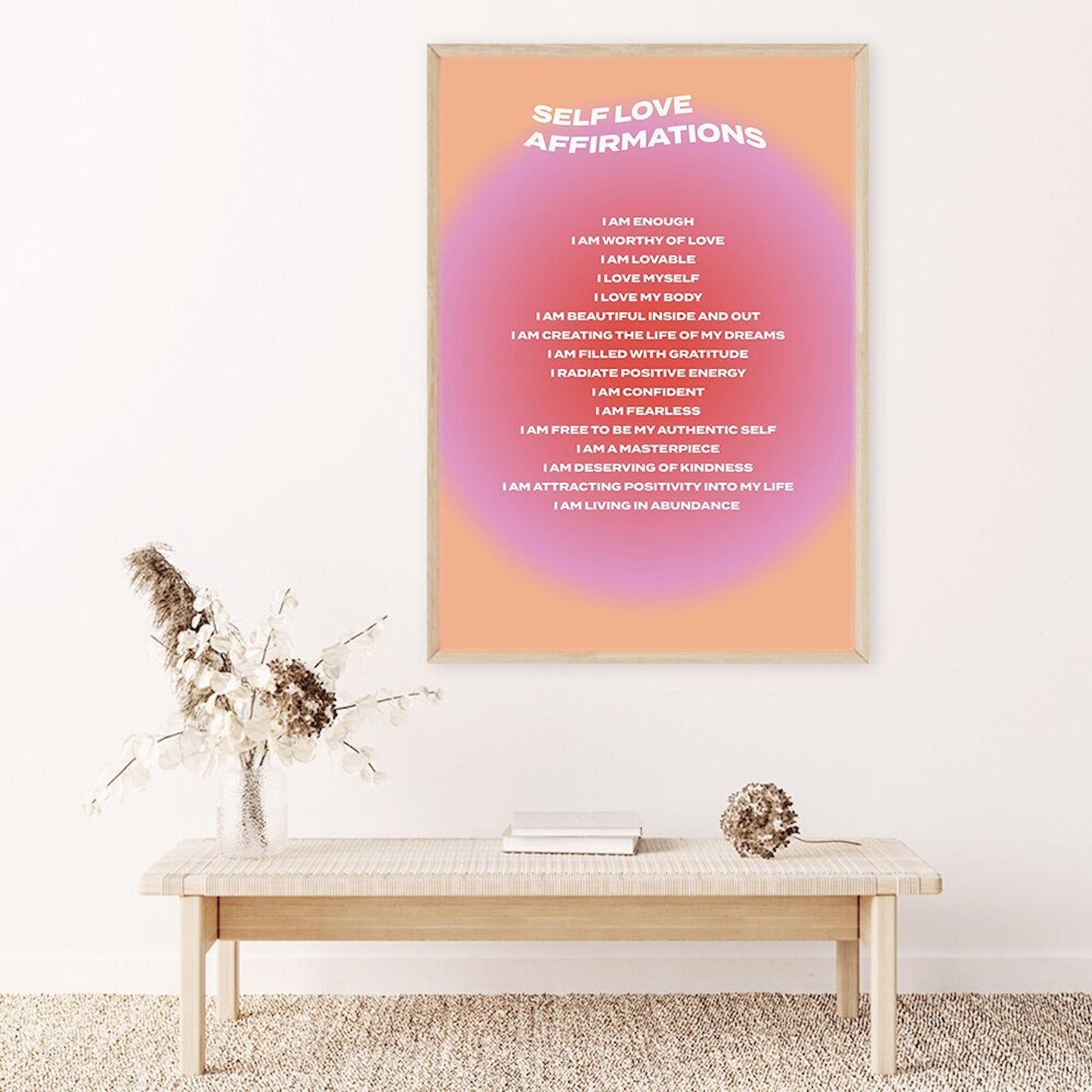 Elegantes Poster "Affirmationen zur Selbstliebe und Mindset Deko Print ohne Rahmen" von justgoodmood, zeigt selbstliebevolle Sprüche auf einer Wand in einem stilvollen Wohnraum mit Blumenarrangement.