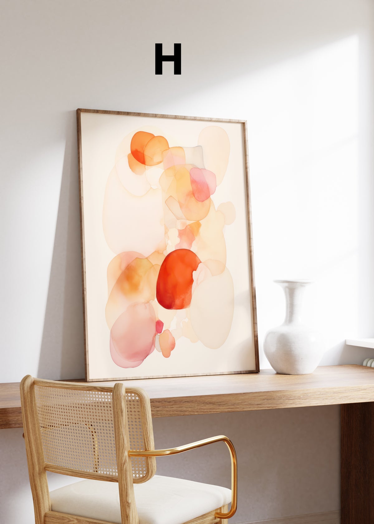 Postermotiv H: Transparente abstrakte Farbformen in Orange, Rosa und Creme. Im Holzrahmen auf einem Schreibtisch.