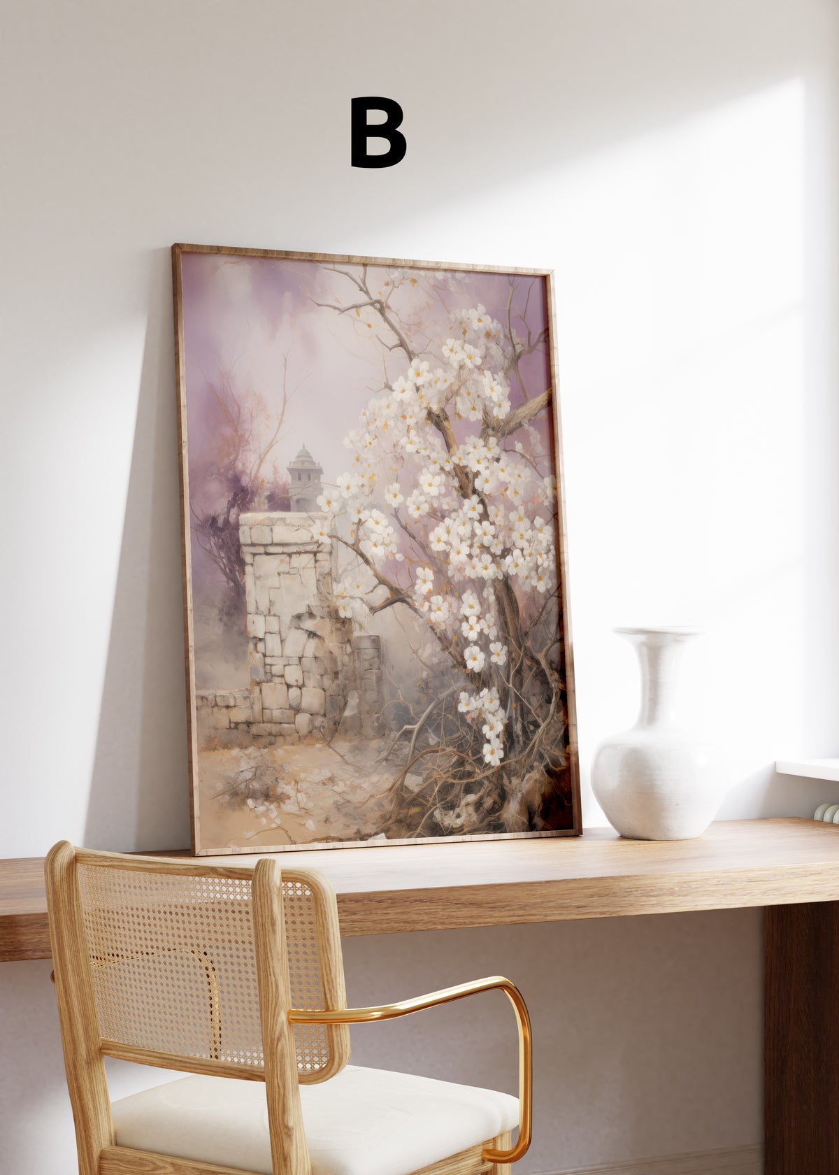 Postermotiv B: Weiße Blüten an einem Zweig neben einer alten Steinmauer. Im Holzrahmen auf einem Schreibtisch.